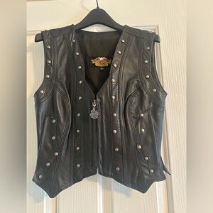 Ladies genuine Harley Davidson leather vest.  Excellent condition. Size small.